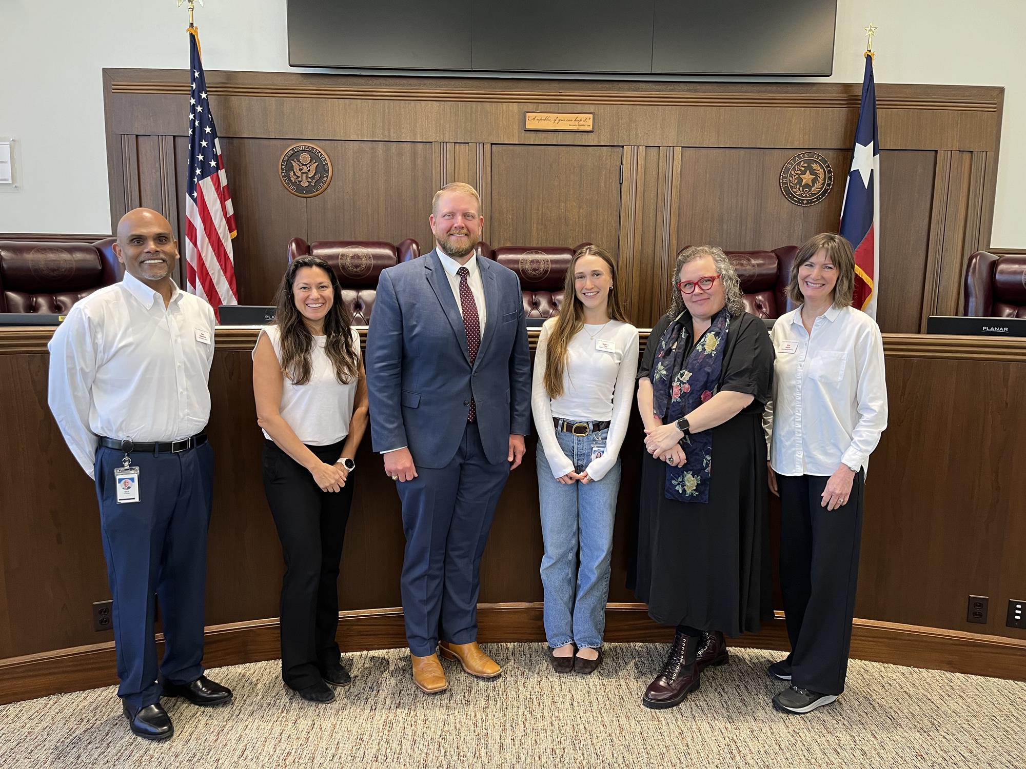 New employees from Texas Association of Counties photographed with Judge Kutscher in Guadalupe County Commissioners Court.